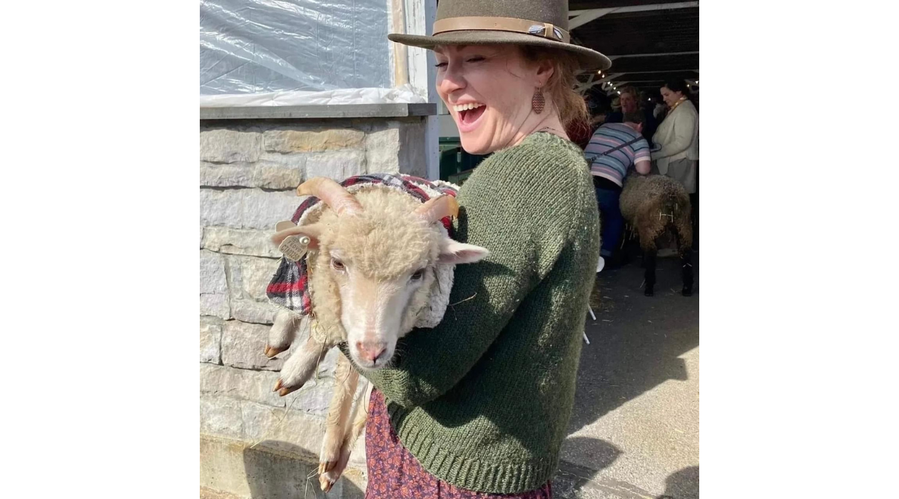 woman holding lamb at sheep and wool festival